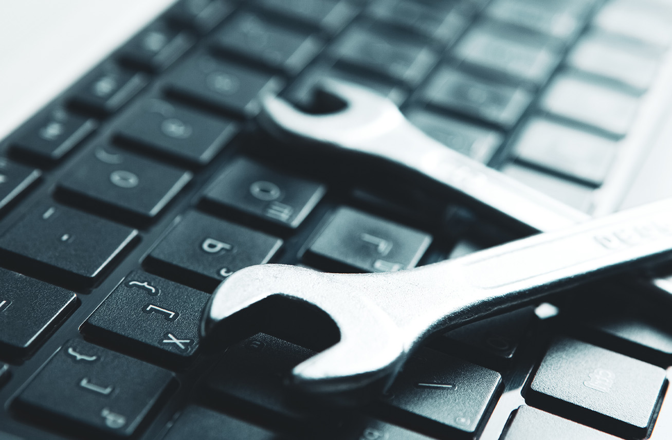 Photo of keyboard and wrench