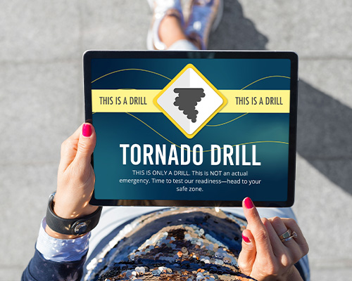 Tornado drill notification showng up on a tablet reaching students on screens of all sizes. 
