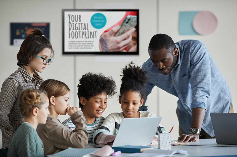 Students reading about their digital footprint, promoting safety and preventing threats 